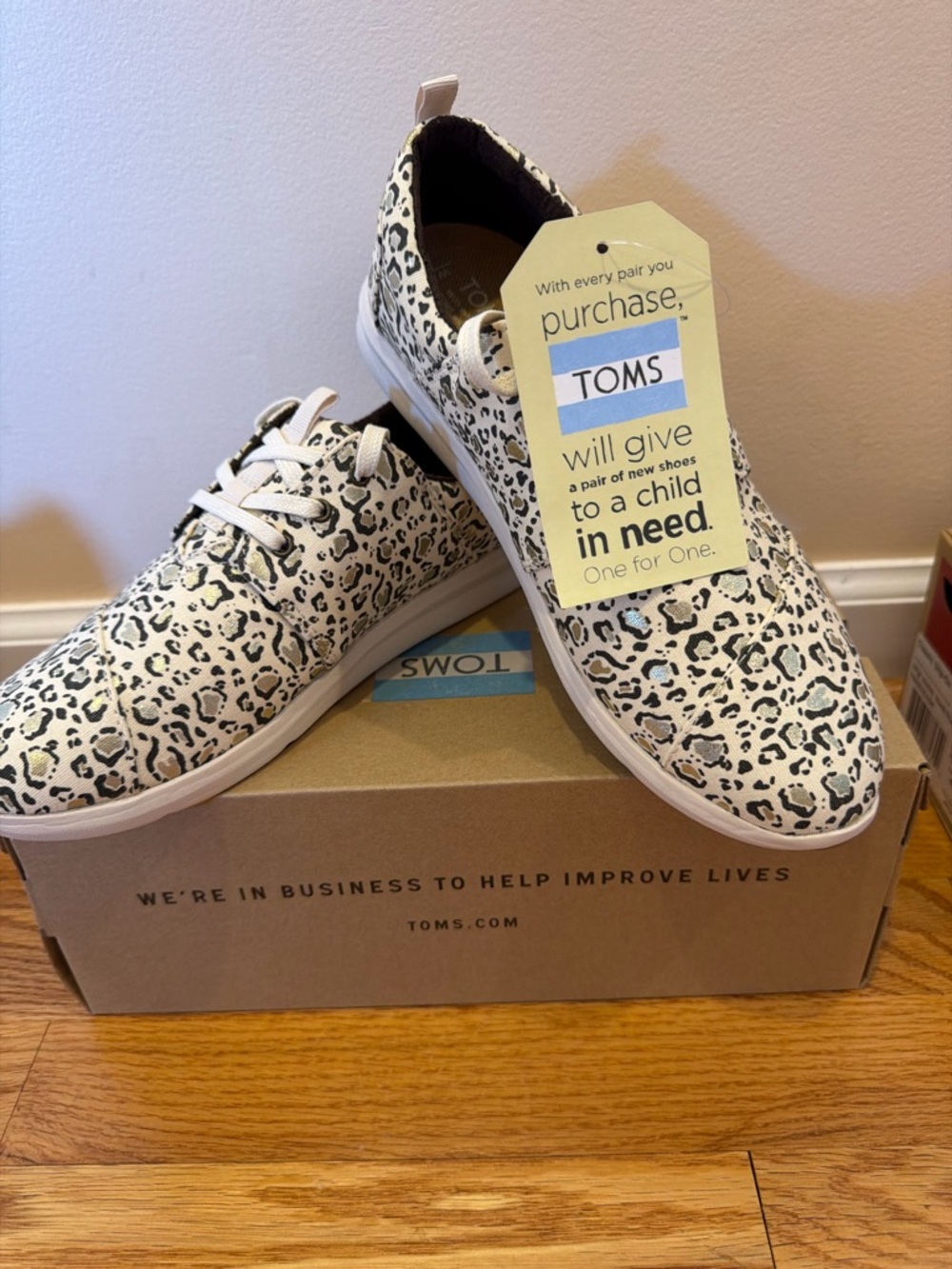 TOMS White and Black Leopard Print Lace-Up Sneakers